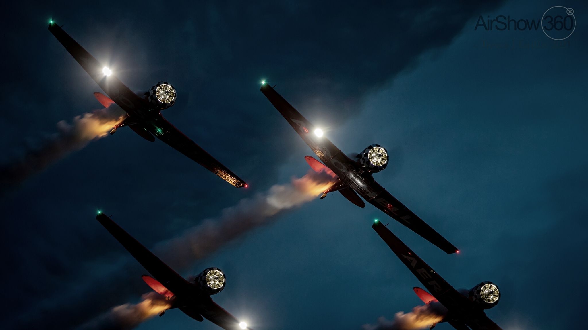 An image of AeroShell Aerobatic Team Performing Night Show